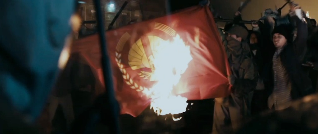 The Hunger Games Catching Fire Trailer Screenshot Capitol Flag on Fire