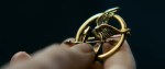 The Hunger Games Catching Fire Trailer Screenshot Mockingjay Pin