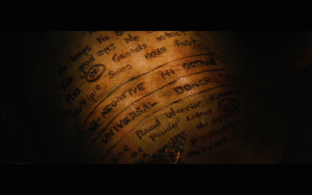 Mad Max Fury Road Comic Con Trailer Screenshot Tattoo 2