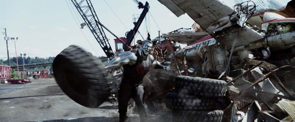 Deadpool Movie Screenshot Stefan Kapicic Colossus Tire Throw